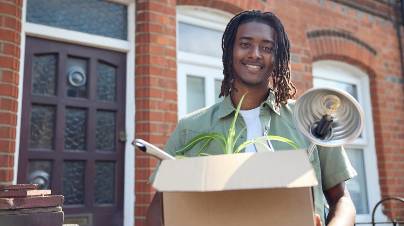 Man moving home with box