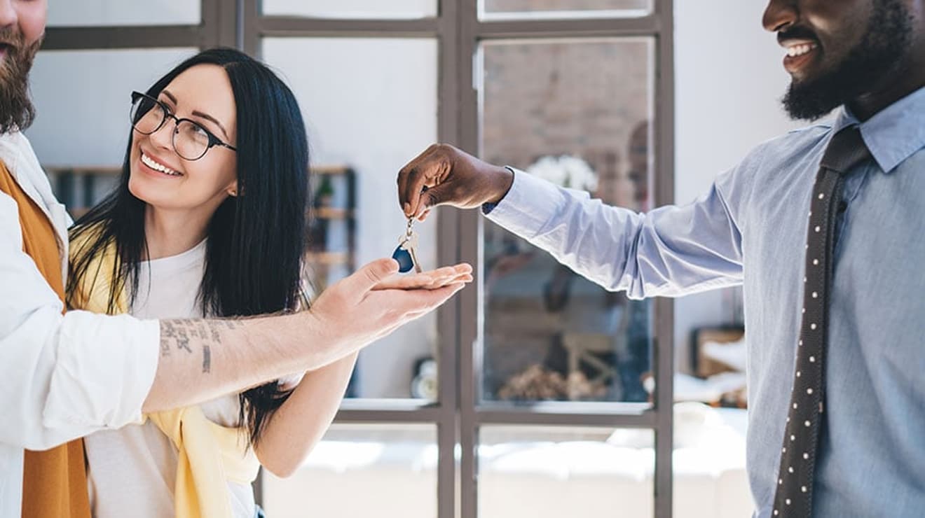 Landlord handing over keys to tenant